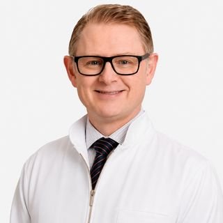 Dr. Charles Riedner